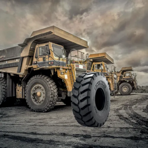 Heavy-duty OTR tyre with construction haul trucks on site